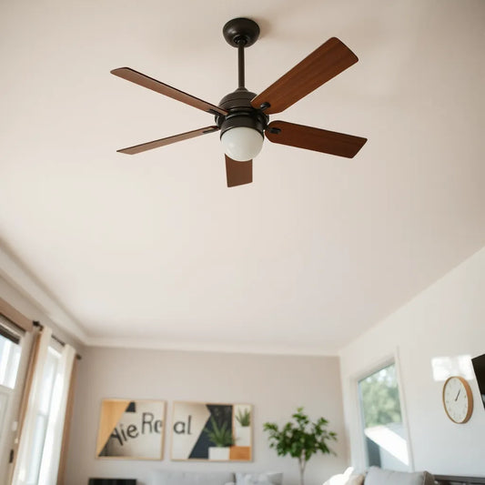 Modern ceiling fan with an extended downrod installed on a high ceiling in a bright living room