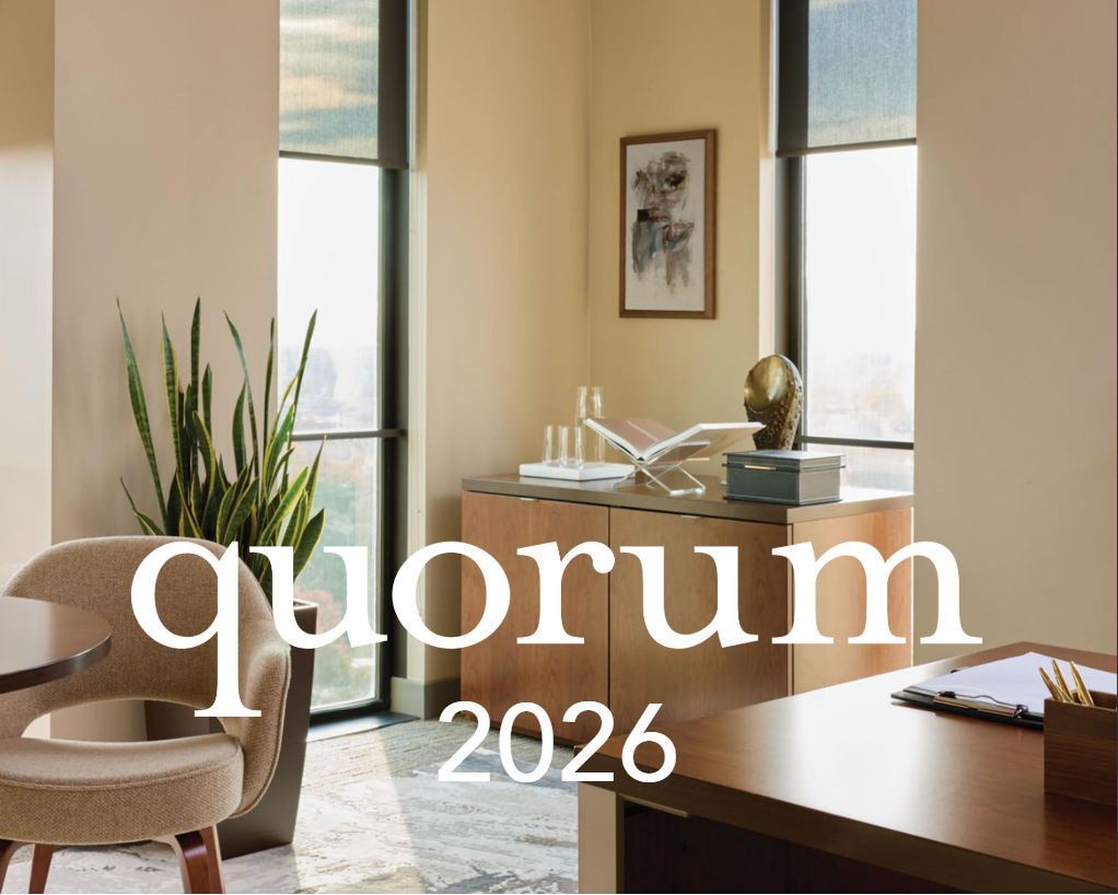 Ceiling fan in a modern office with 'quorum 2026' branding.